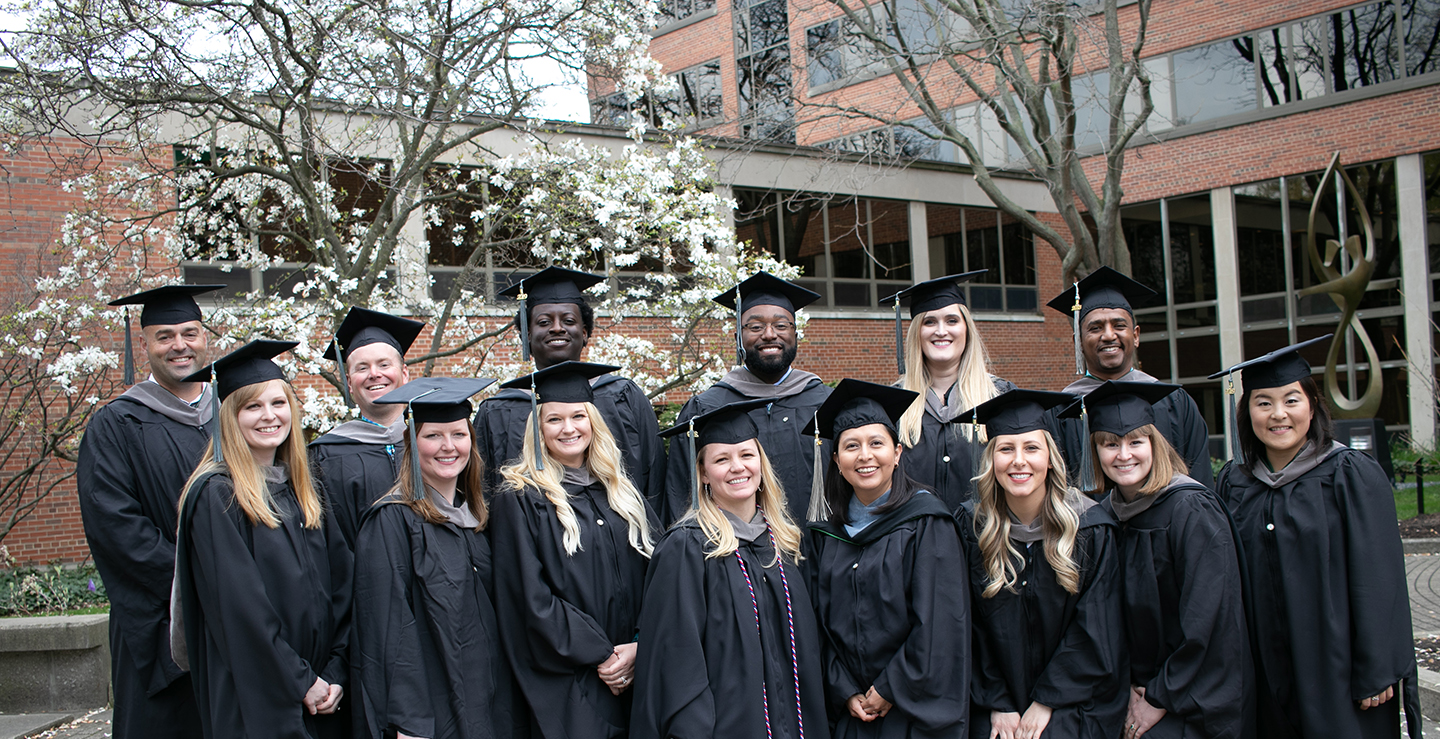 group of graduates in cap and gowns