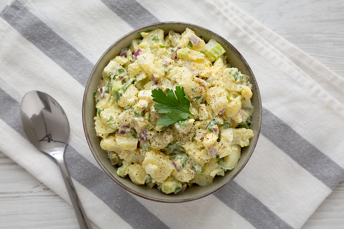potato salad in bowl on table cloth